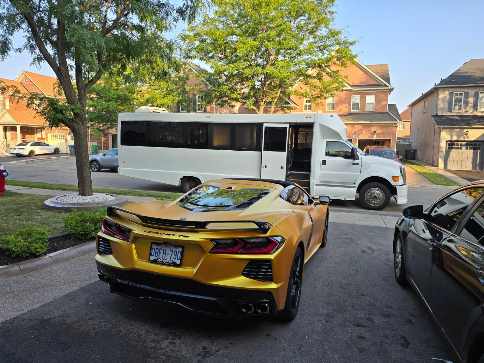 Galaxy Limo party bus waiting on a residential street for a prom pickup
