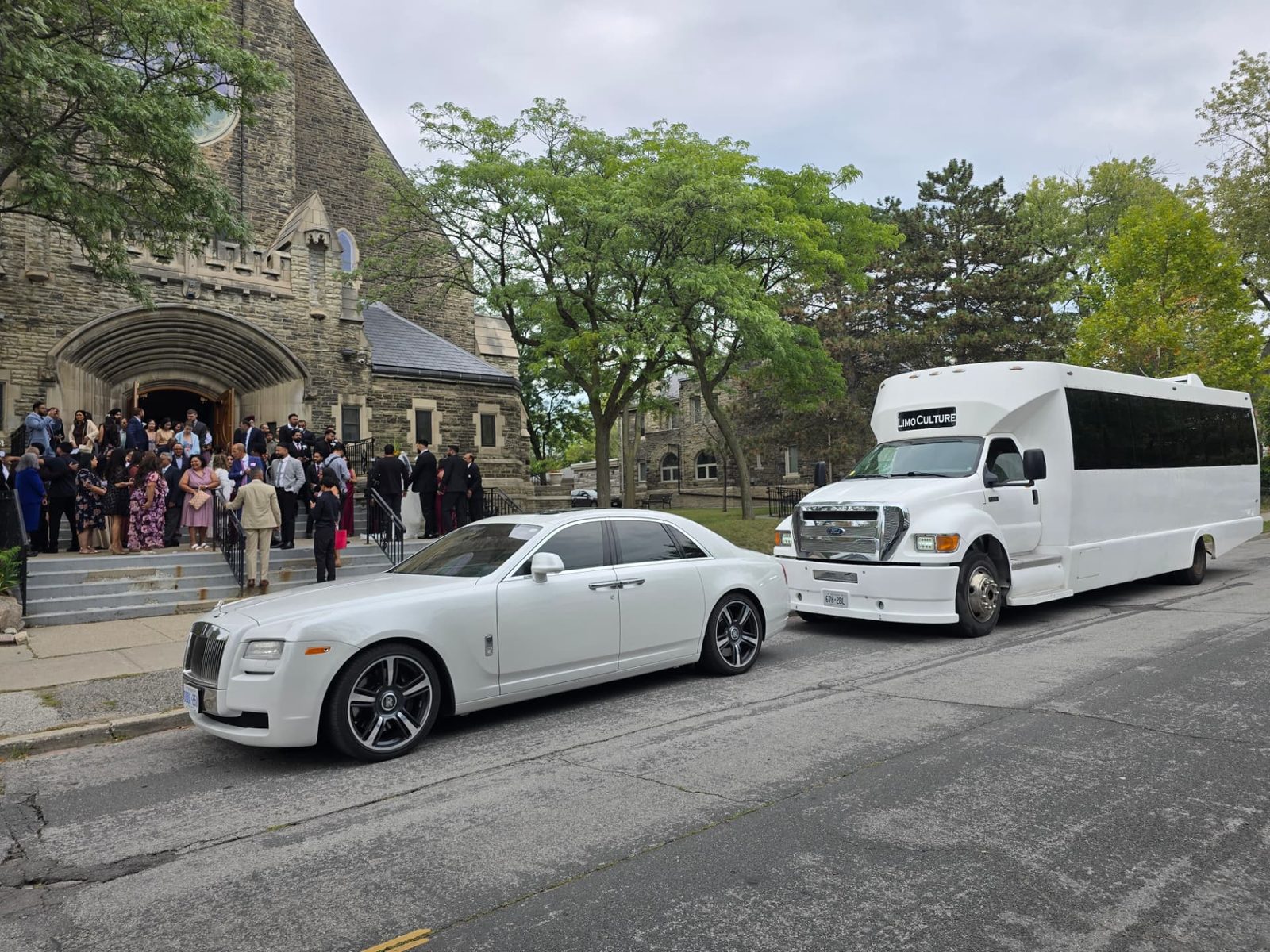 Galaxy Limo Rolls Royce and limo bus waiting outside a Toronto church for a wedding party